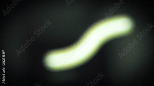 Abstract Glowing Neon Light Trail In S-Curve Shape On Dark Background For Creative Design Projects