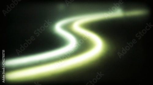 Abstract Motion Blur Of Winding Glowing Light Trails On Dark Background Representing Speed And Connectivity