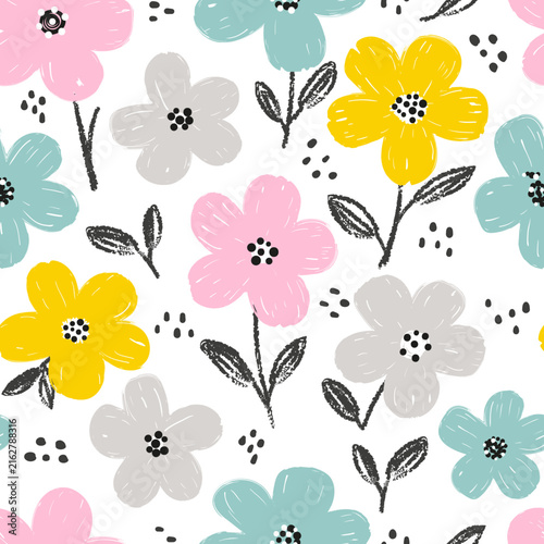 Seamless floral pattern wih hand drawn cartoon flowers. Childish vector print
