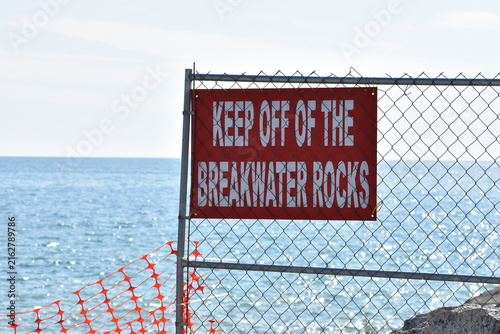 Keep off the breakwater rocks warning sign