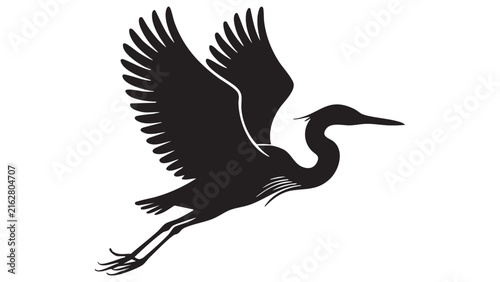 Black silhouette of a heron in flight against a white background