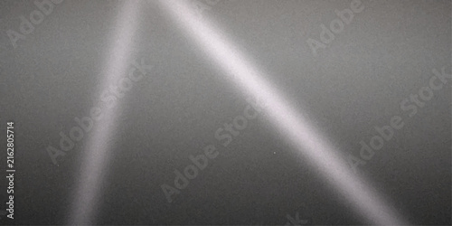 Abstract light streaks with diagonal lines forming an A-shape on a textured gray background, creating a sense of modern design and subtle movement.