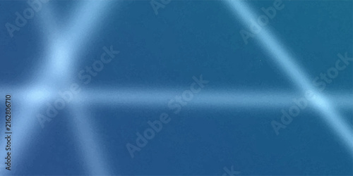 Abstract blue background with light streaks and bokeh effect, representing a futuristic or technological concept.