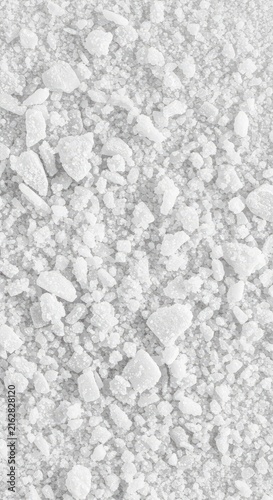 A high contrast, extremely bright white crystalline powder texture filling the frame completely, suggesting purity, clean energy, and abstract materiality ,mineral ,background ,reflective