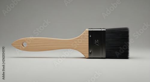 Wooden Handle Paint Brush with Black Bristles Isolated on a Clean Neutral Gray Background for Professional Home Improvement and Artistic Projects