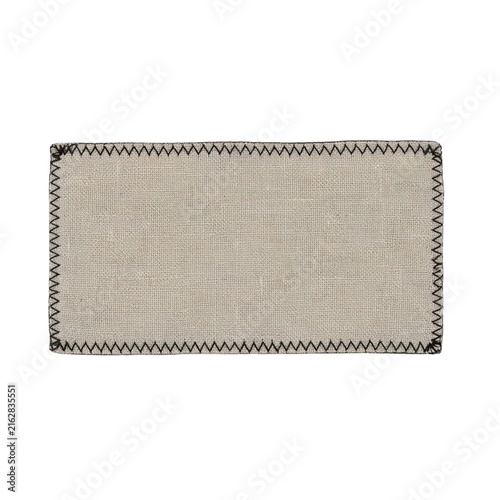 Plain rectangular textile tag made of natural linen, black zigzag stitching around the perimeter, transparent background, high-detail fabric weave, clean and simple appearance.