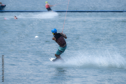 Wakeboarder Riding Through Water with Dynamic Splash