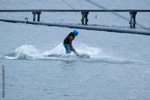 Wakeboarder Riding Through Water with Dynamic Splash