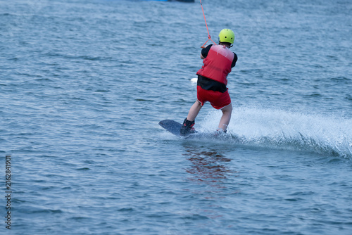 Wakeboarder Riding Through Water with Dynamic Splash