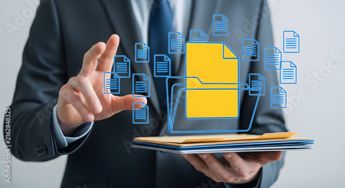 Businessman managing digital files with virtual folder interface and document icons for cloud storage and professional data organization system