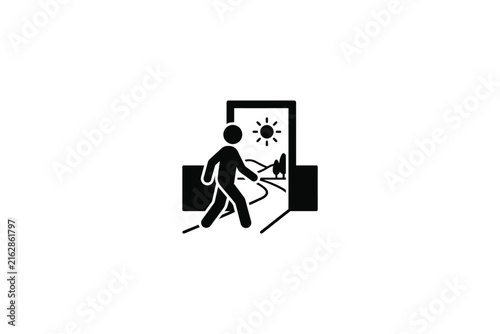 Person walking through an open doorway towards a bright sunny landscape.