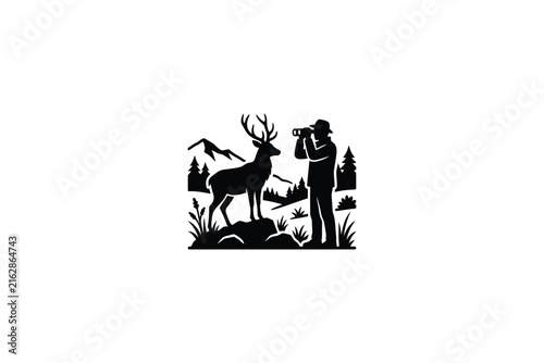 Silhouette of a photographer observing a deer in a forest landscape.