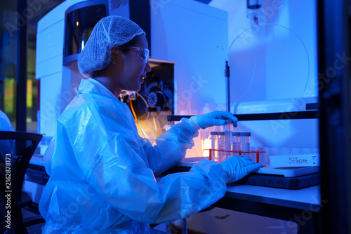 Scientist Conducting Chemistry Research in Laboratory with Protective Gear