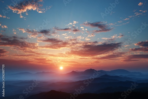 Breathtaking Sunrise Over Mountains with Colorful Sky and Radiant Sunlight Spreading Across the Horizon