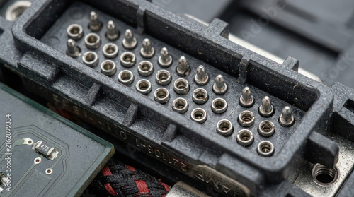 Close up of a large electrical connector with many pins.