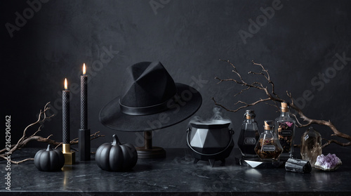 Modern witch hat and cauldron with potions for halloween celebration