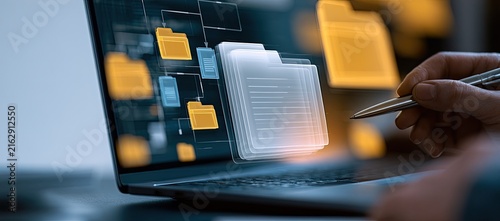 Digital document management on a laptop screen with a stylus.