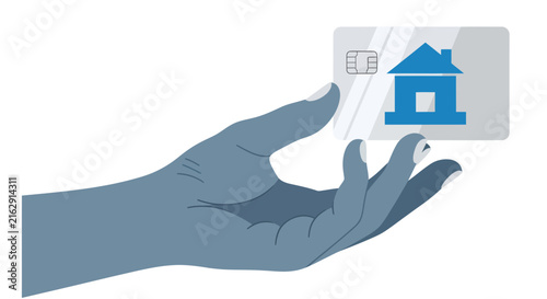 Hand holding a credit card with a house icon, representing real estate financing, mortgage loans, and property investment concept.