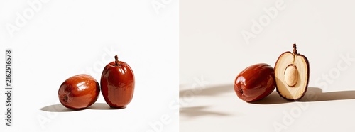 Two Ripe Jujube Fruits, One Cut in Half, Showcasing the Seed and Flesh.