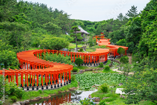 red wooden gate or torii at takayama inari shrine aomori japan are famous for a stunning path of hundreds of vermilion torii gates