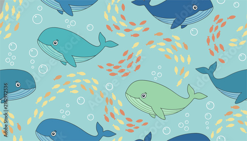 Playful seamless children pattern featuring cute cartoon whales and swirling schools of small orange and yellow fish.
