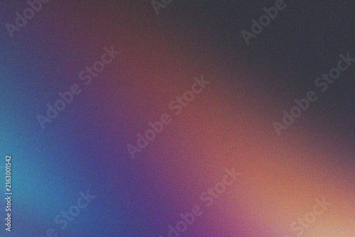 Abstract background with subtle grainy texture and a gradient of deep blue, purple, and orange hues.