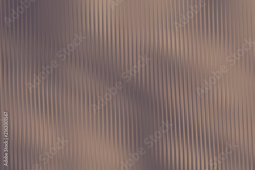 Neutral toned background with vertical ribbed texture and soft, diffused light creating subtle shadows.
