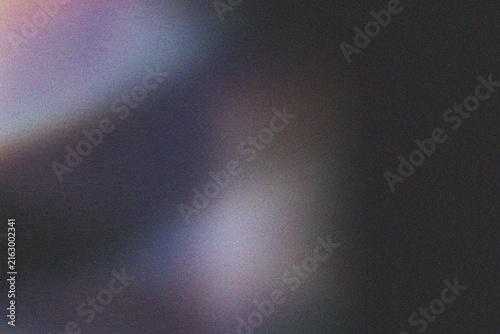 Dark, grainy background with a diagonal beam of bright, multicolored light creating a luminous effect.