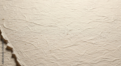 Textured beige paper background with subtle creases