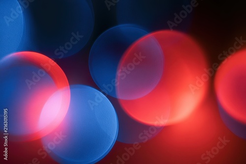 Dreamy bokeh in crimson and cyan: soft red and blue light blur