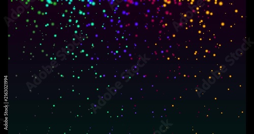 Abstract dark background with falling multicolored glowing light particles and dots