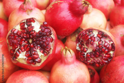 Fresh ripe pomegranate fruits close up as background	