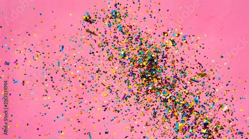 Vibrant Pink Confetti Cascade Across Bold Background.