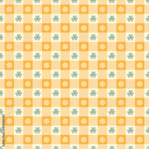 Seamless checkered, clover leaf and flower vector pattern. Shamrocks on Gingham tablecloth pattern texture for textiles, cards, stationery, phone cases, paper gifts, wallpaper, and wrapping.