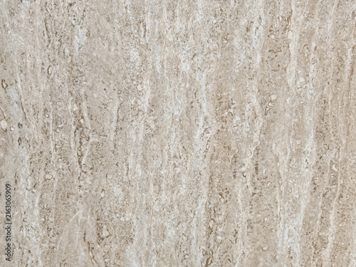 High resolution close-up texture of polished beige travertine marble stone surface featuring natural porous grain pattern target for architectural interior design rendering luxury wall tile background