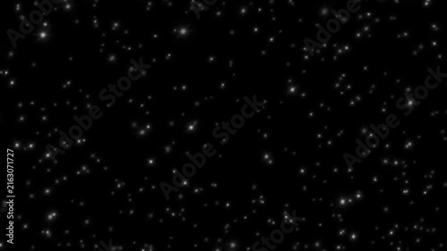 Stars shine softly across a dark black background.
