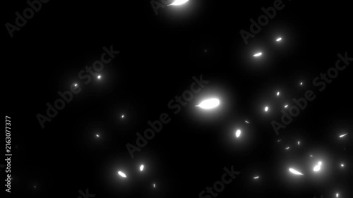 White feather sparks drift across a black background.