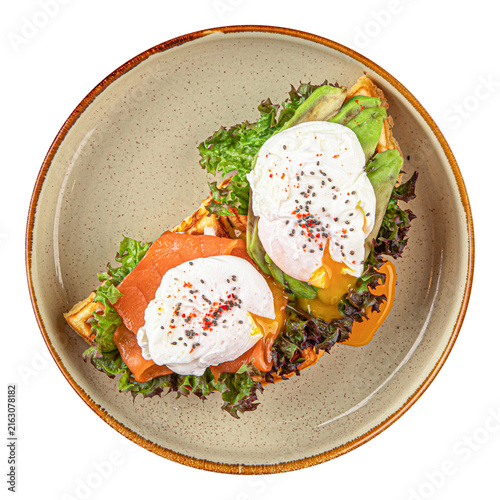 Waffles with salmon and poached eggs