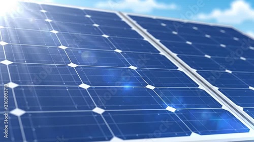 Close-up of a solar panel array with bright sunlight and lens flares, representing renewable energy and sustainable technology