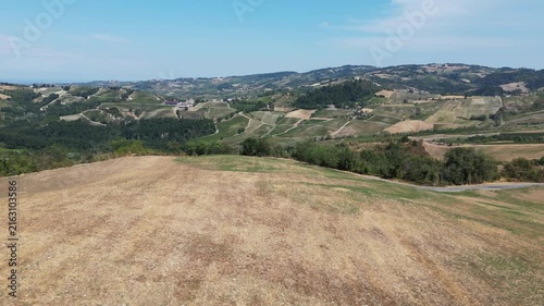 Europe, Italy, Lombardy, Pavia, Montù Berchielli – drone view of the Oltrepò Pavese hills; drought and water shortages lead to an early grape harvest for wine production. Global warming and climate ch