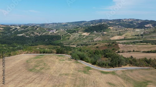 Europe, Italy, Lombardy, Pavia, Montù Berchielli – drone view of the Oltrepò Pavese hills; drought and water shortages lead to an early grape harvest for wine production. Global warming and climate ch