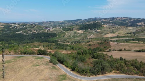 Europe, Italy, Lombardy, Pavia, Montù Berchielli – drone view of the Oltrepò Pavese hills; drought and water shortages lead to an early grape harvest for wine production. Global warming and climate ch