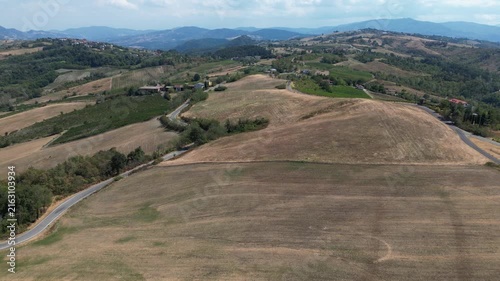 Europe, Italy, Lombardy, Pavia, Montù Berchielli – drone view of the Oltrepò Pavese hills; drought and water shortages lead to an early grape harvest for wine production. Global warming and climate ch