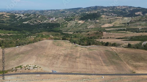Europe, Italy, Lombardy, Pavia, Montù Berchielli – drone view of the Oltrepò Pavese hills; drought and water shortages lead to an early grape harvest for wine production. Global warming and climate ch