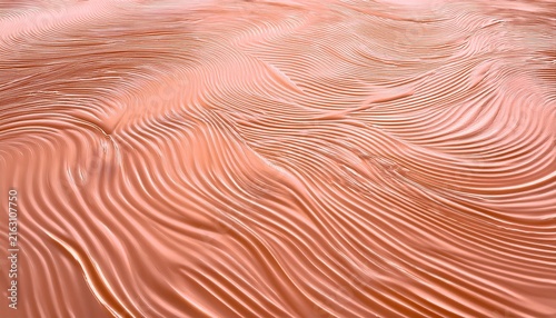 ripples on a soft peach surface reflecting light in a serene abstract pattern