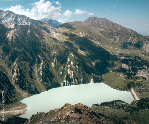 Turquoise Glacial Lake Surrounded by Rugged Alpine Mountains