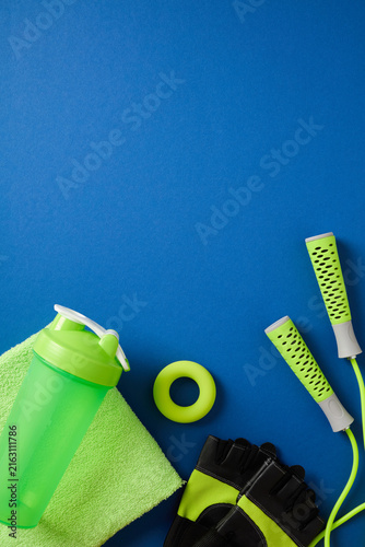 Green fitness equipment bottom border on dark blue background.