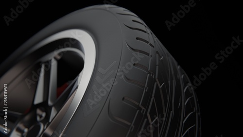 Close-up of a Modern Car Tire Tread and Alloy Wheel Rim