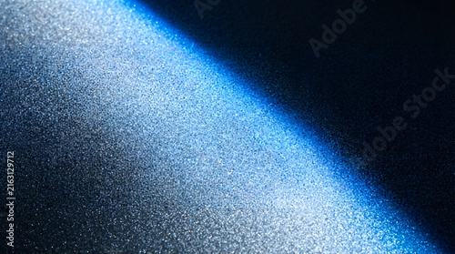Abstract Shimmering Metallic Surface With Cinematic Blue Diagonal Light Beam