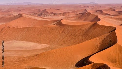 Quadro su tela red dunes of the Namib desert from a bird’s eye view
529